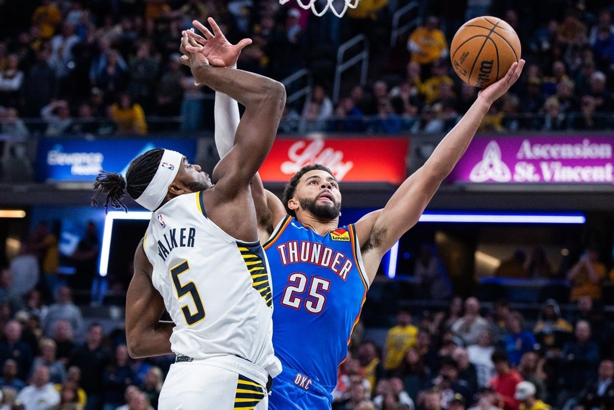 Oct 23, 2025; Indianapolis, Indiana, USA;  Oklahoma City Thunder guard Ajay Mitchell (25) shoots the ball while Indiana Pacers forward Jarace Walker (5) defends in the second half at Gainbridge Fieldhouse. Mandatory Credit: Trevor Ruszkowski-Imagn Images