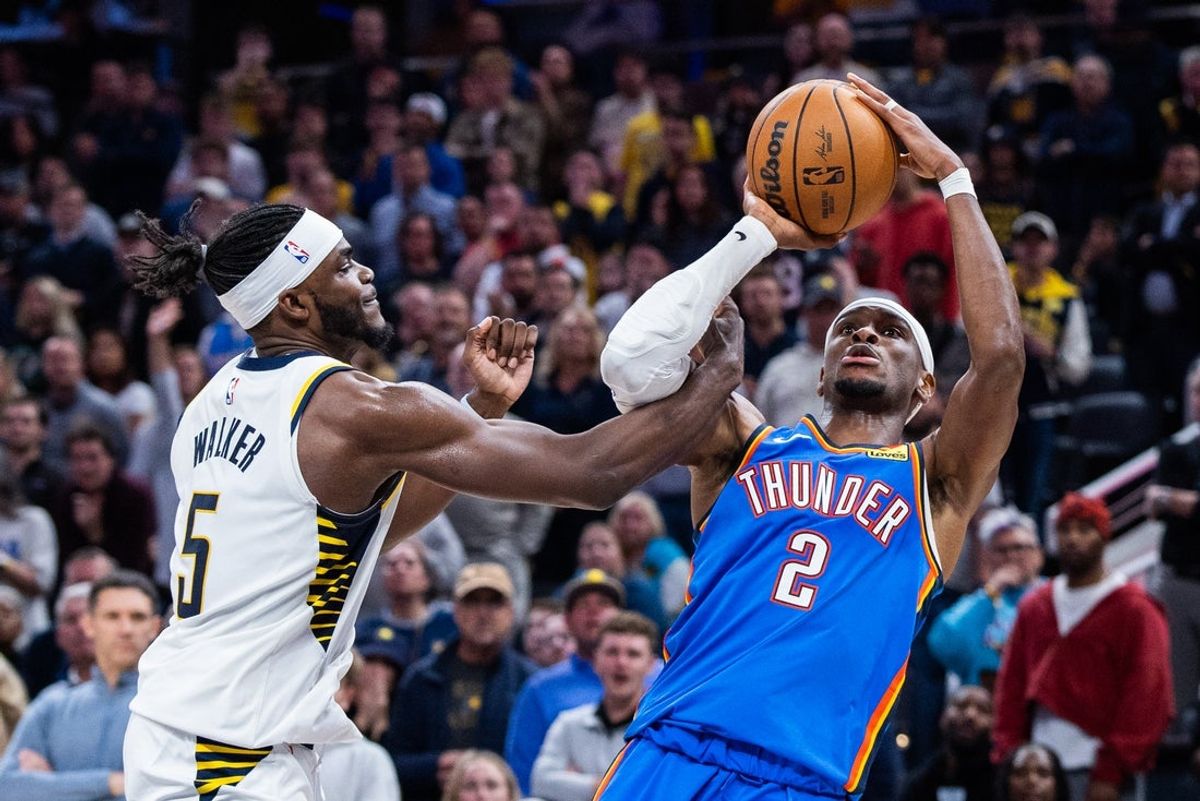 Oct 23, 2025; Indianapolis, Indiana, USA;  Oklahoma City Thunder guard Shai Gilgeous-Alexander (2) shoots the ball while Indiana Pacers forward Jarace Walker (5) defends in the second half at Gainbridge Fieldhouse. Mandatory Credit: Trevor Ruszkowski-Imagn Images