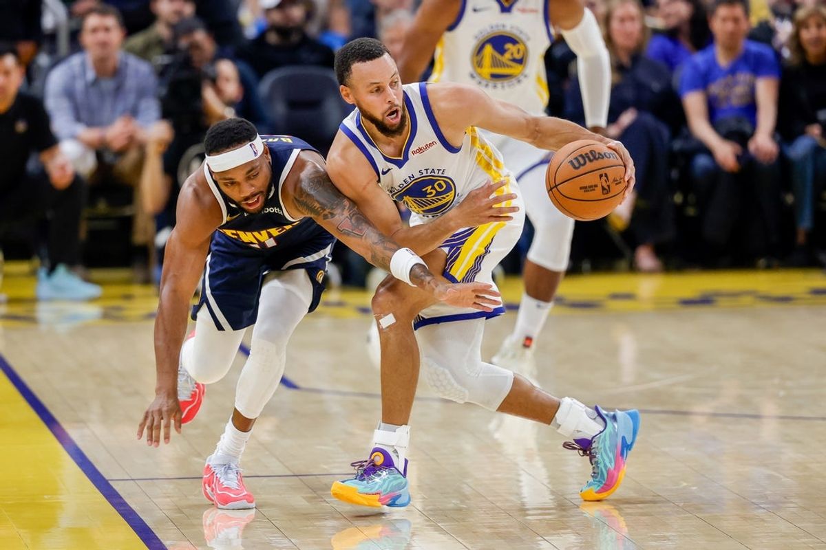 Oct 23, 2025; San Francisco, California, USA;  Golden State Warriors guard Stephen Curry (30) steals the ball from Denver Nuggets guard BruceBrown (11) during the second quarter at Chase Center. Mandatory Credit: Bob Kupbens-Imagn Images