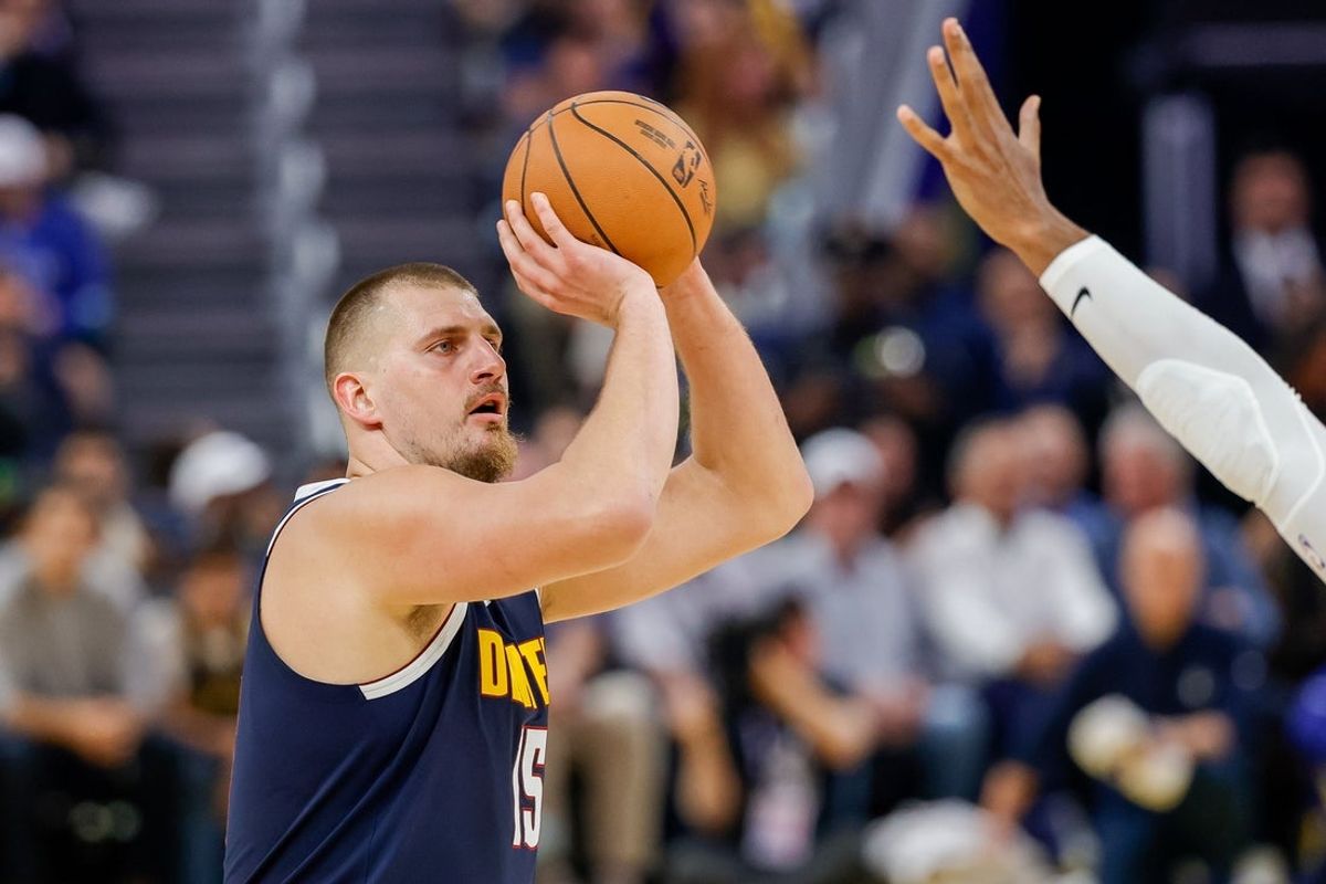 Oct 23, 2025; San Francisco, California, USA;  Denver Nuggets center Nikola Jokic (15) shoots against the Golden State Warriors during the second quarter at Chase Center. Mandatory Credit: Bob Kupbens-Imagn Images