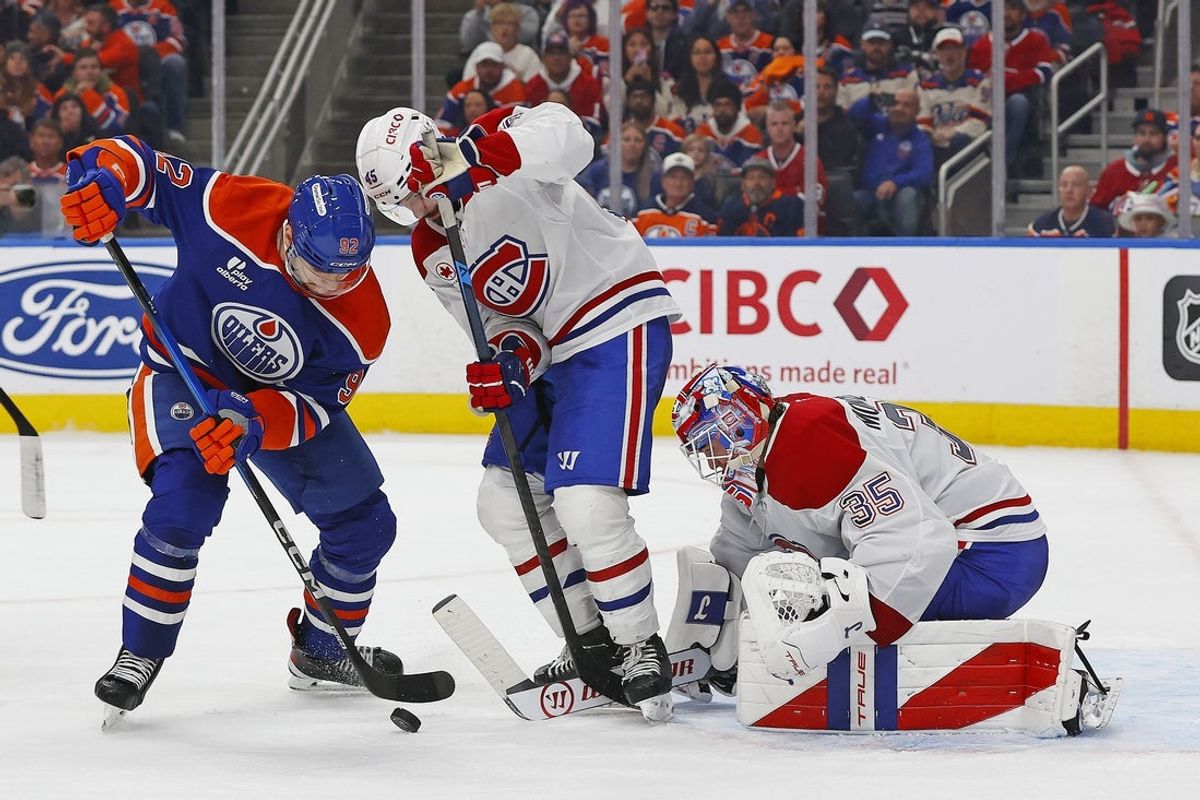Oct 23, 2025; Edmonton, Alberta, CAN; Edmonton Oilers forward Vasily Podkolzin (92) looks for a loose puck in front of Montreal Canadiens goaltender Sam Montembeault (35) during the third period at Rogers Place. Mandatory Credit: Perry Nelson-Imagn Images
