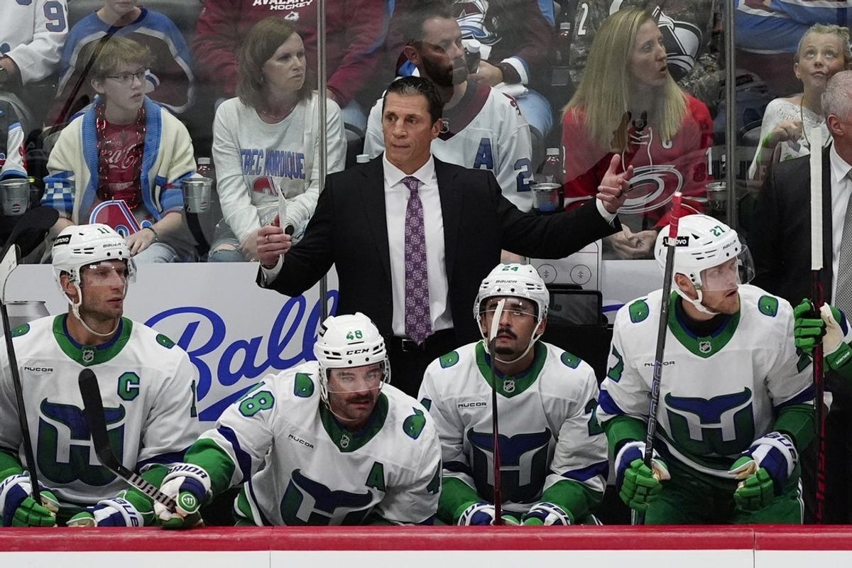 Oct 23, 2025; Denver, Colorado, USA; Carolina Hurricanes head coach Rod Brind'Amour reacts on the bench in the third period against the Colorado Avalanche at Ball Arena. Mandatory Credit: Ron Chenoy-Imagn Images