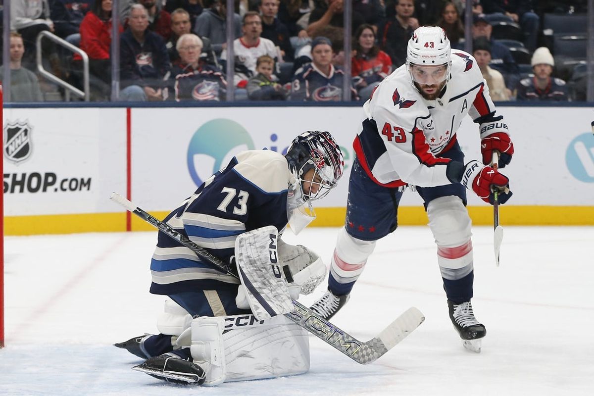 Oct 24, 2025; Columbus, Ohio, USA; Columbus Blue Jackets goalie Jet Greaves (73) makes a save as Washington Capitals right wing Tom Wilson (43) looks for a rebound during the first period at Nationwide Arena. Mandatory Credit: Russell LaBounty-Imagn Images