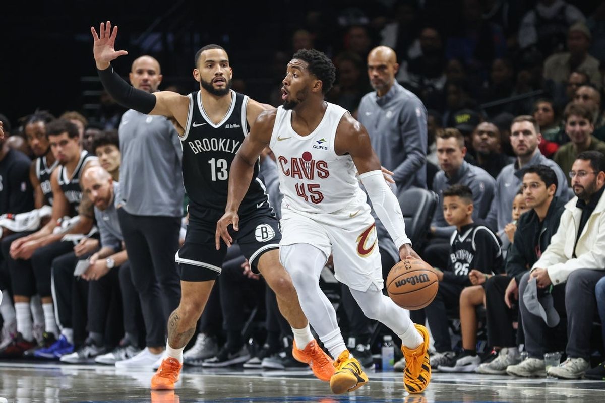 Oct 24, 2025; Brooklyn, New York, USA;  Cleveland Cavaliers guard Donovan Mitchell (45) looks to drive past Brooklyn Nets guard Tyrese Martin (13) in the first quarter at Barclays Center. Mandatory Credit: Wendell Cruz-Imagn Images