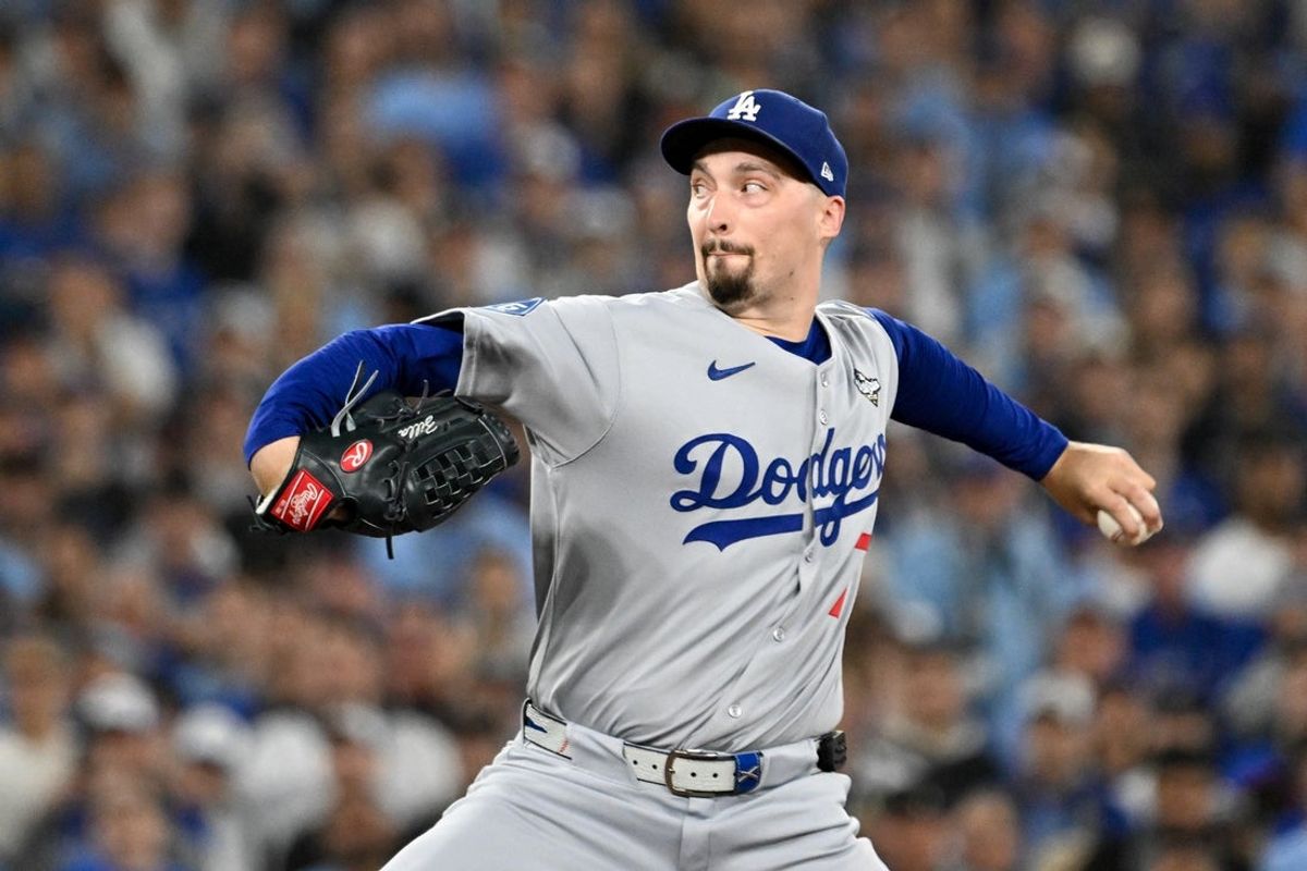 Oct 24, 2025; Toronto, Ontario, CAN; Los Angeles Dodgers pitcher Blake Snell (7) throws a pitch against the Toronto Blue Jays in the first inning during game one of the 2025 MLB World Series at Rogers Centre. Mandatory Credit: Dan Hamilton-Imagn Images
