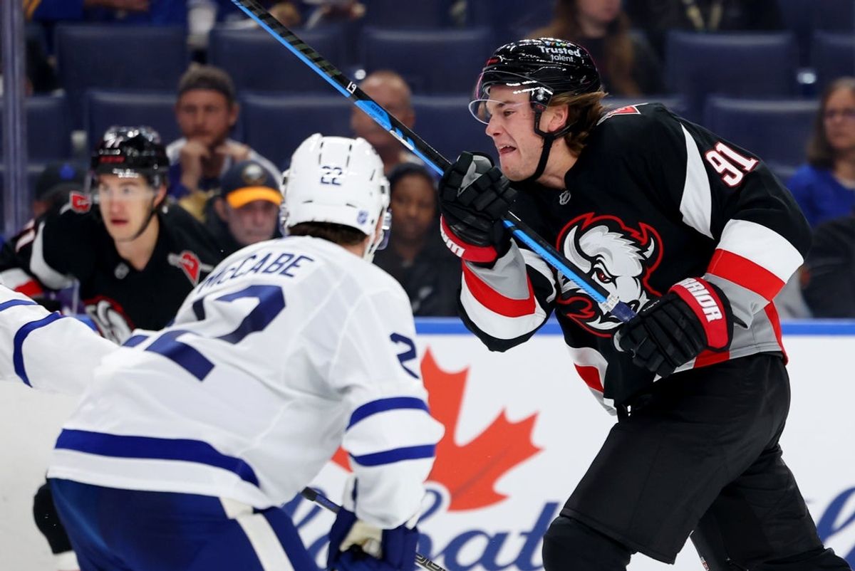 Oct 24, 2025; Buffalo, New York, USA;  Buffalo Sabres right wing Josh Doan (91) goes after a loose puck during the second period against the Toronto Maple Leafs at KeyBank Center. Mandatory Credit: Timothy T. Ludwig-Imagn Images