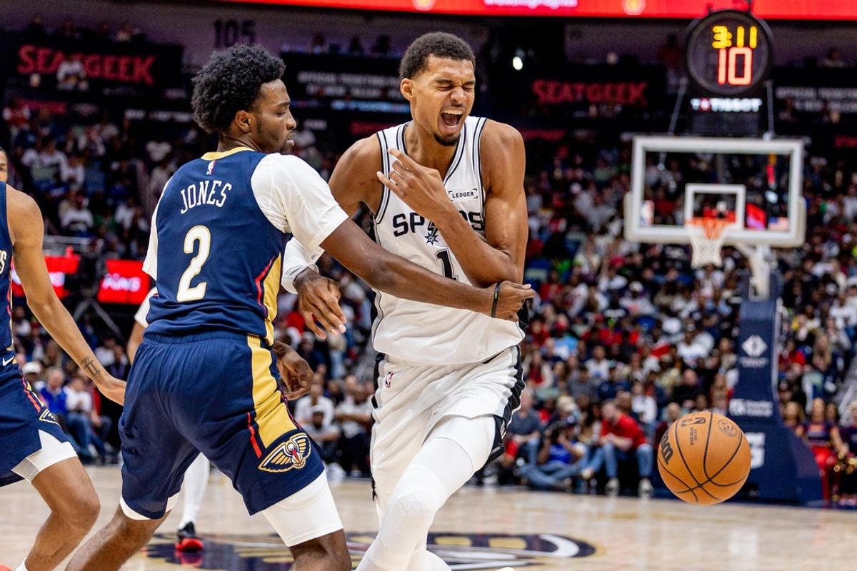 Oct 24, 2025; New Orleans, Louisiana, USA;  New Orleans Pelicans forward Herbert Jones (2) fouls New Orleans Pelicans forward Zion Williamson (1) on a play during the first half at Smoothie King Center. Mandatory Credit: Stephen Lew-Imagn Images