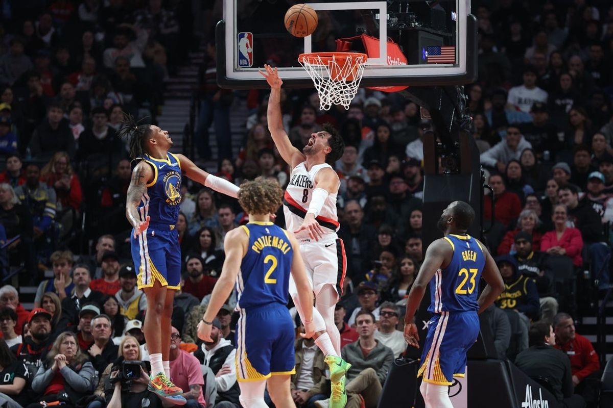 Oct 24, 2025; Portland, Oregon, USA; Portland Trail Blazers forward Deni Avdija (8) shoots the ball over Golden State Warriors guard Will Richard (3), guard Brandin Podziemski (2) and guard Will Richard (3) in the first half at Moda Center. Mandatory Credit: Jaime Valdez-Imagn Images