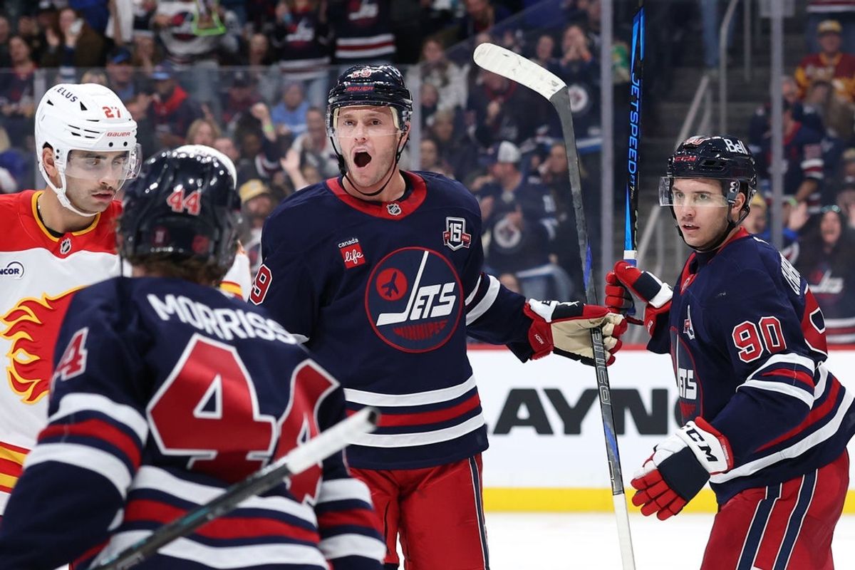 Oct 24, 2025; Winnipeg, Manitoba, CAN; Winnipeg Jets center Jonathan Toews (19) celebrates a goal against the Calgary Flames in the second period at Canada Life Centre. Mandatory Credit: James Carey Lauder-Imagn Images