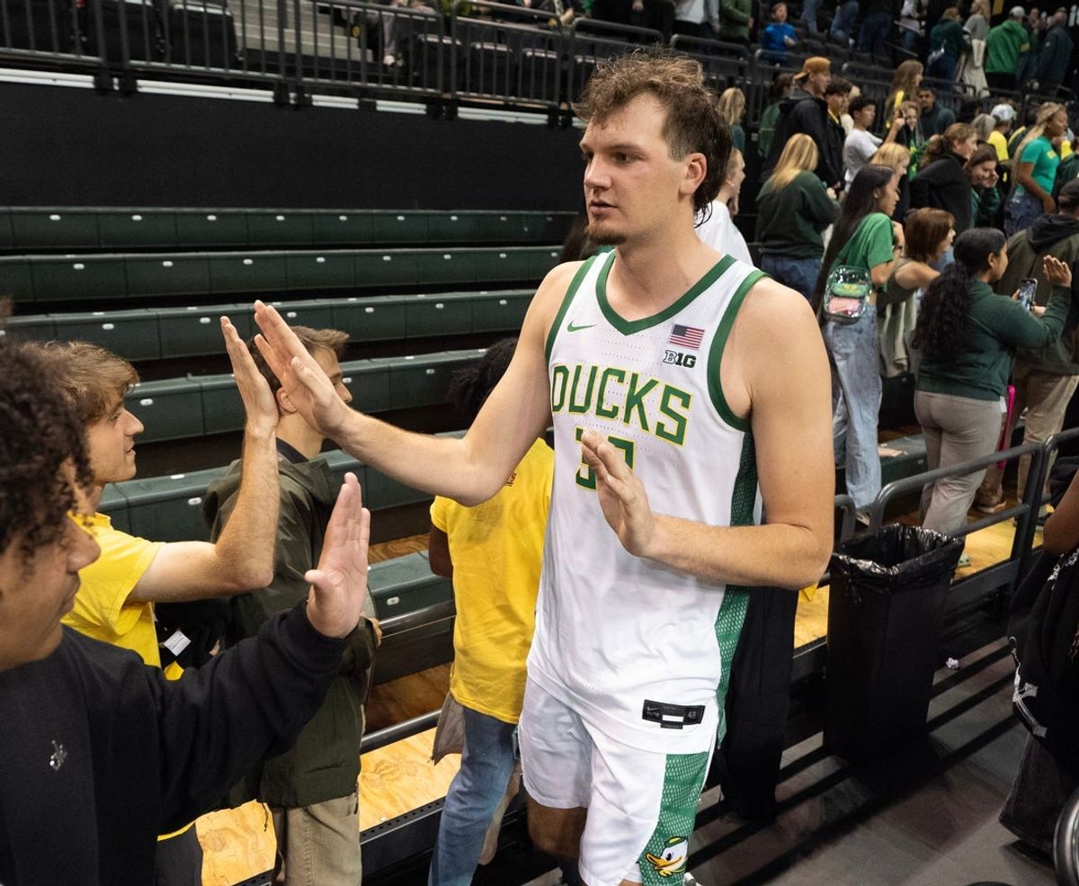 Oregon Nate Bittle celebrates an exhibition game win against Utah after the game at Matthew Knight Arena Oct. 24, 2025.