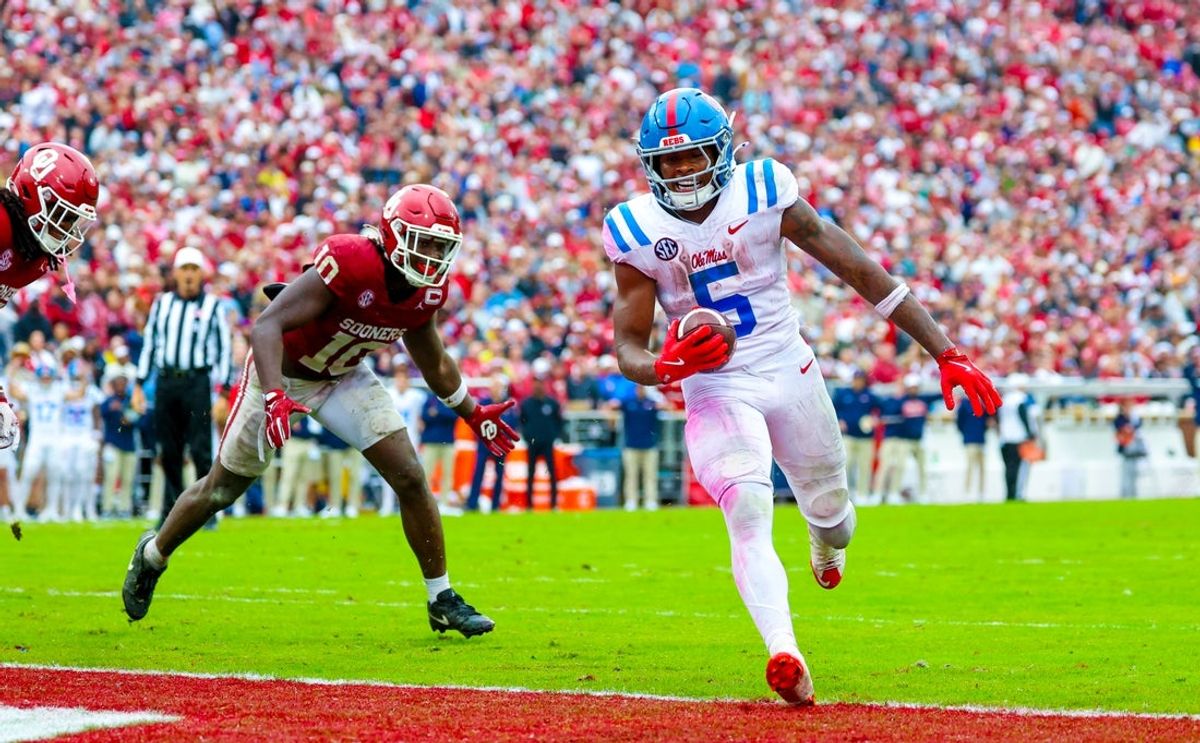 Oct 25, 2025; Norman, Oklahoma, USA;  Ole Miss Rebels running back Kewan Lacy (5) runs past Oklahoma Sooners linebacker Kip Lewis (10) and scores a touchdown during the second quarter at Gaylord Family-Oklahoma Memorial Stadium. Mandatory Credit: Kevin Jairaj-Imagn Images