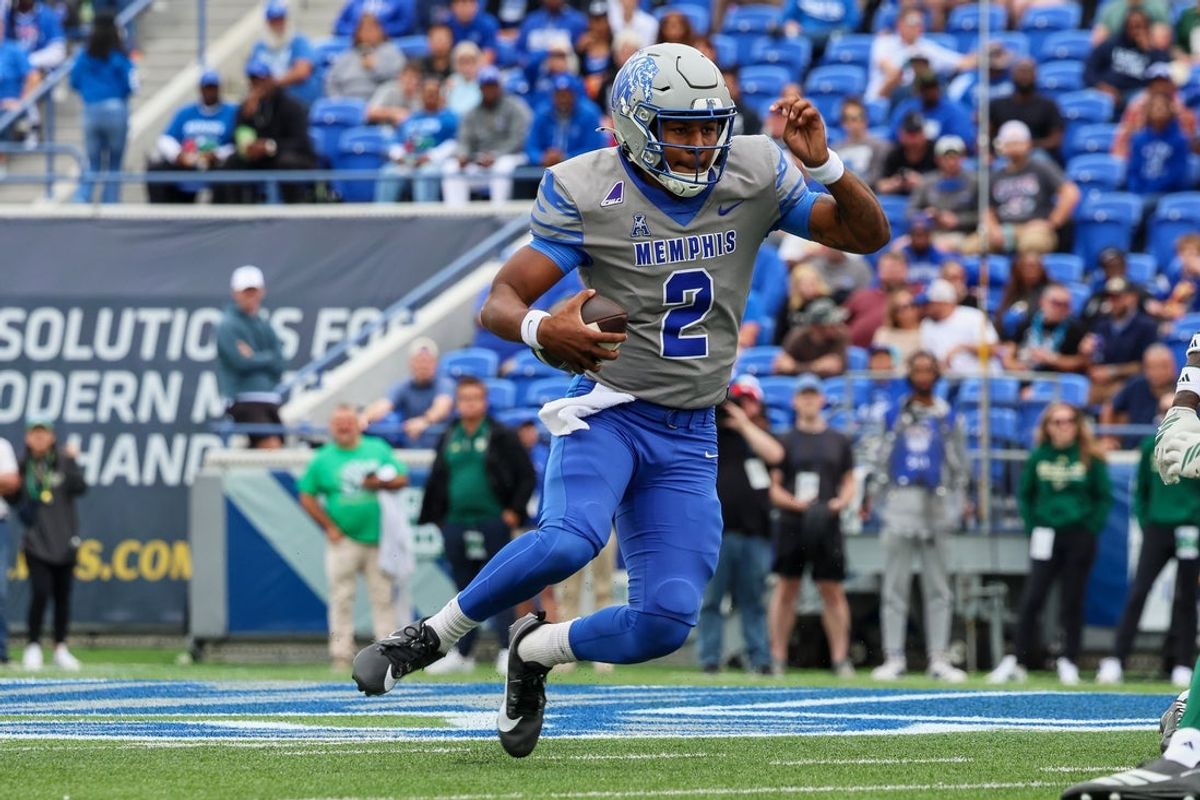 Oct 25, 2025; Memphis, Tennessee, USA; Memphis Tigers quarterback Brendon Lewis (2) runs with the ball against the South Florida Bulls during the second quarter at Simmons Bank Liberty Stadium. Mandatory Credit: Wesley Hale-Imagn Images