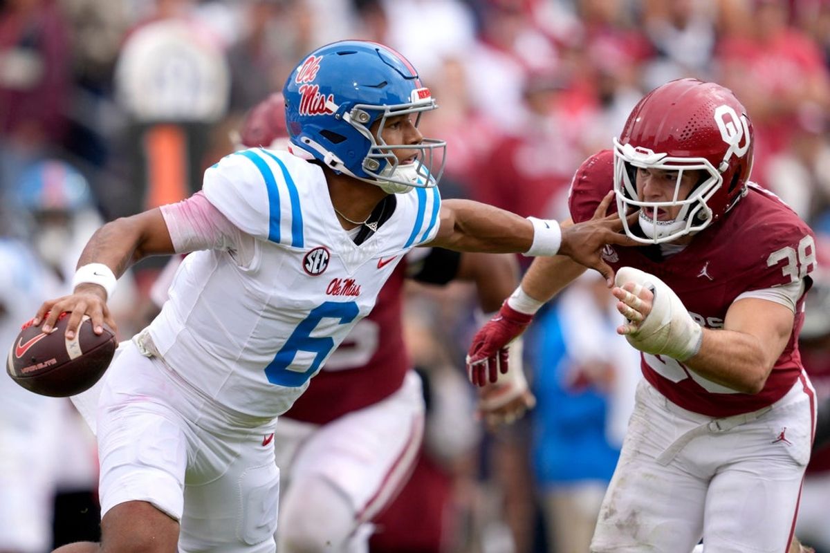 Ole Miss Rebels quarterback Trinidad Chambliss (6) tries to pass as Oklahoma Sooners linebacker Owen Heinecke (38) chases after him during a college football game between the University of Oklahoma Sooners (OU) and the Ole Miss Rebels at Gaylord Family Ð Oklahoma Memorial Stadium in Norman, Okla., Saturday, Oct. 25, 2025. Ole Miss won 34-26.