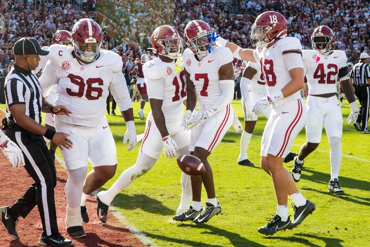 Oct 25, 2025; Columbia, South Carolina, USA; Alabama Crimson Tide defensive back Dashawn Jones (7) celebrates a interception return for a touchdown against the South Carolina Gamecocks in the first quarter at Williams-Brice Stadium. Mandatory Credit: Jeff Blake-Imagn Images