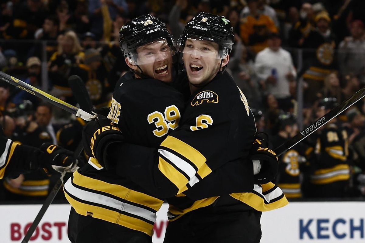 Oct 25, 2025; Boston, Massachusetts, USA; Boston Bruins center Morgan Geekie (39) is congratulated by defenseman Mason Lohrei (6) after scoring against the Colorado Avalanche during the second period at TD Garden. Mandatory Credit: Winslow Townson-Imagn Images