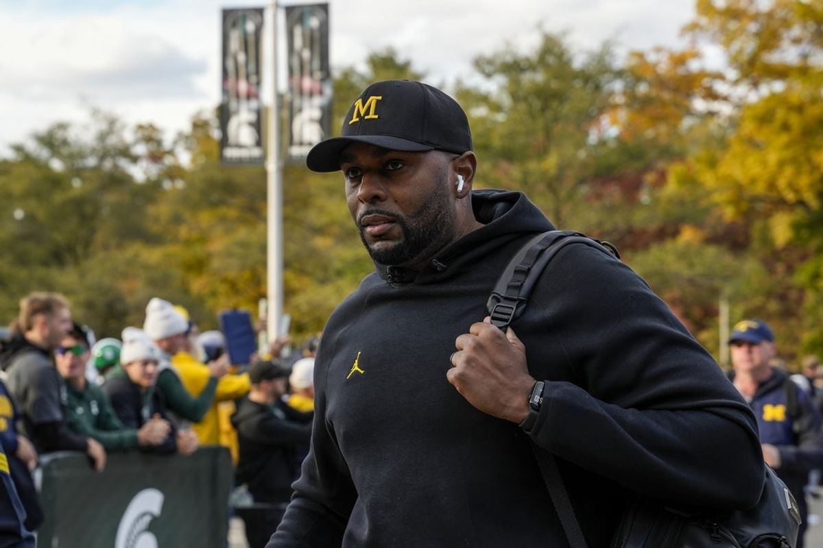 Oct 25, 2025; East Lansing, Michigan, USA; University of Michigan head coach Sherrone Moore walks into Spartan Stadium before a game against the Michigan State Spartans. Mandatory Credit: Brendan Mullin-Imagn Images