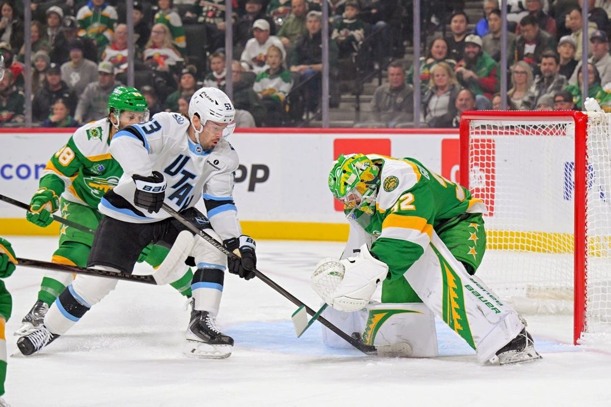 Oct 25, 2025; Saint Paul, Minnesota, USA;  Minnesota Wild goalie Filip Gustavsson (32) makes a save on Utah Mammoth forward Michael Carcone (53) during the first period at Grand Casino Arena. Mandatory Credit: Nick Wosika-Imagn Images