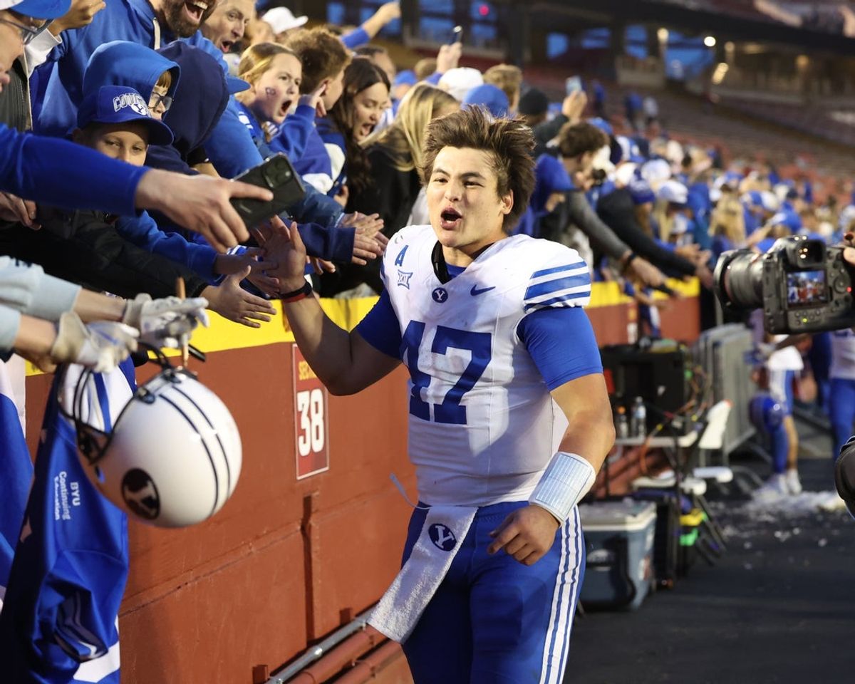 Oct 25, 2025; Ames, Iowa, USA;  BYU Cougars quarterback Bear Bachmeier (47) celebrates with fans after the Cougars beat the Iowa State Cyclones at Jack Trice Stadium. Mandatory Credit: Reese Strickland-Imagn Images