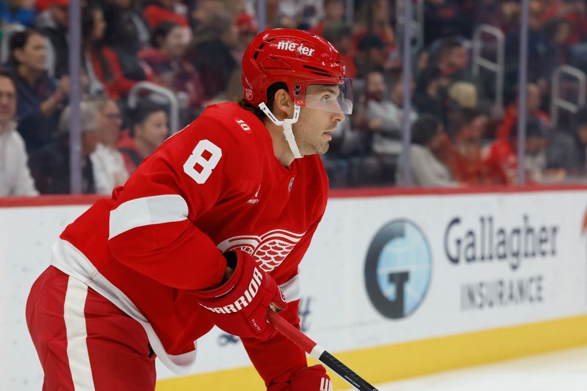 Oct 25, 2025; Detroit, Michigan, USA;  Detroit Red Wings defenseman Ben Chiarot (8) skates with the puck in the first period against the St. Louis Blues at Little Caesars Arena. Mandatory Credit: Rick Osentoski-Imagn Images