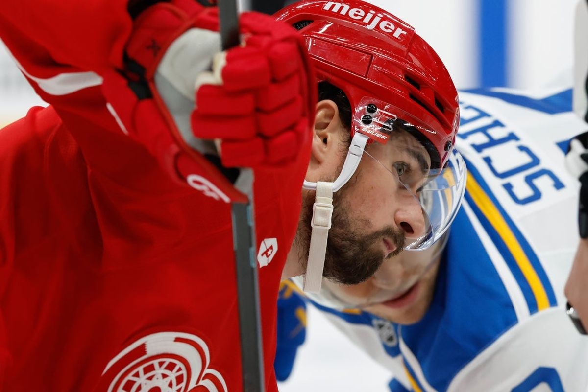 Oct 25, 2025; Detroit, Michigan, USA;  Detroit Red Wings center Dylan Larkin (71) and St. Louis Blues center Brayden Schenn (10) gets set to face off in the first period at Little Caesars Arena. Mandatory Credit: Rick Osentoski-Imagn Images