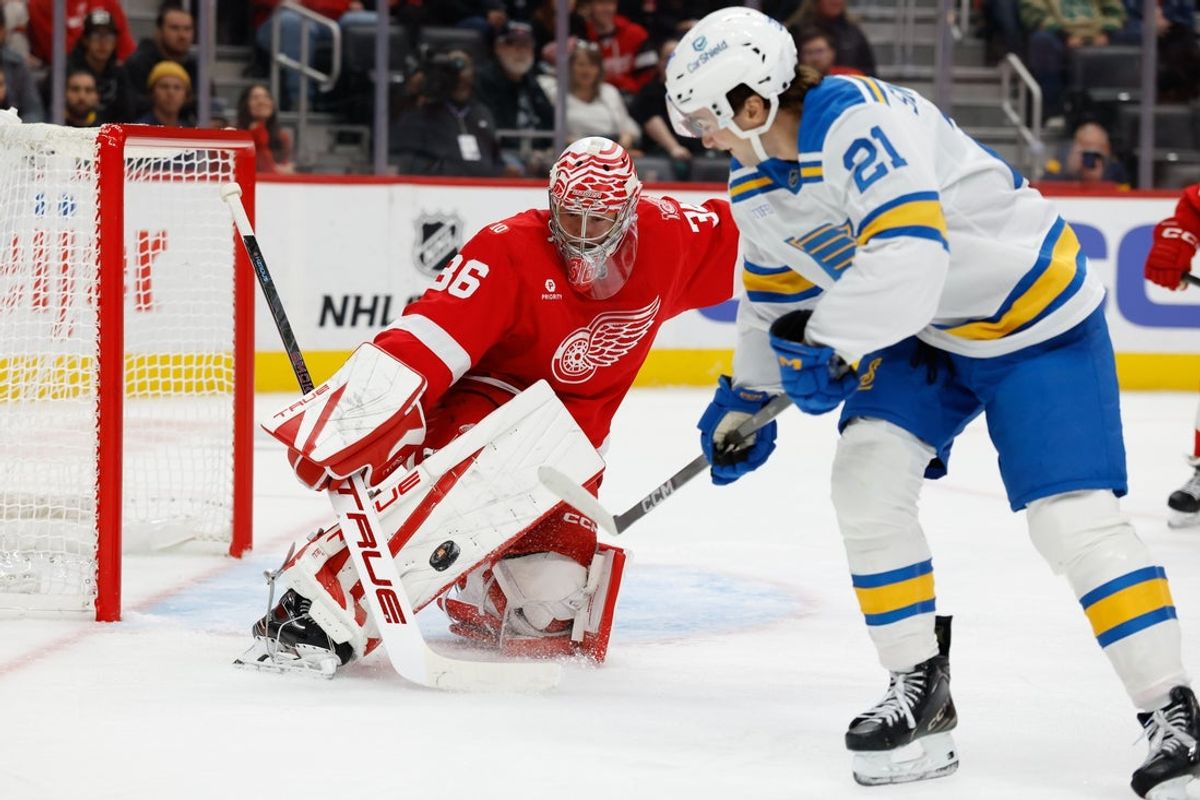 Oct 25, 2025; Detroit, Michigan, USA;  Detroit Red Wings goaltender John Gibson (36) makes the save on St. Louis Blues right wing Jimmy Snuggerud (21) in the first period at Little Caesars Arena. Mandatory Credit: Rick Osentoski-Imagn Images