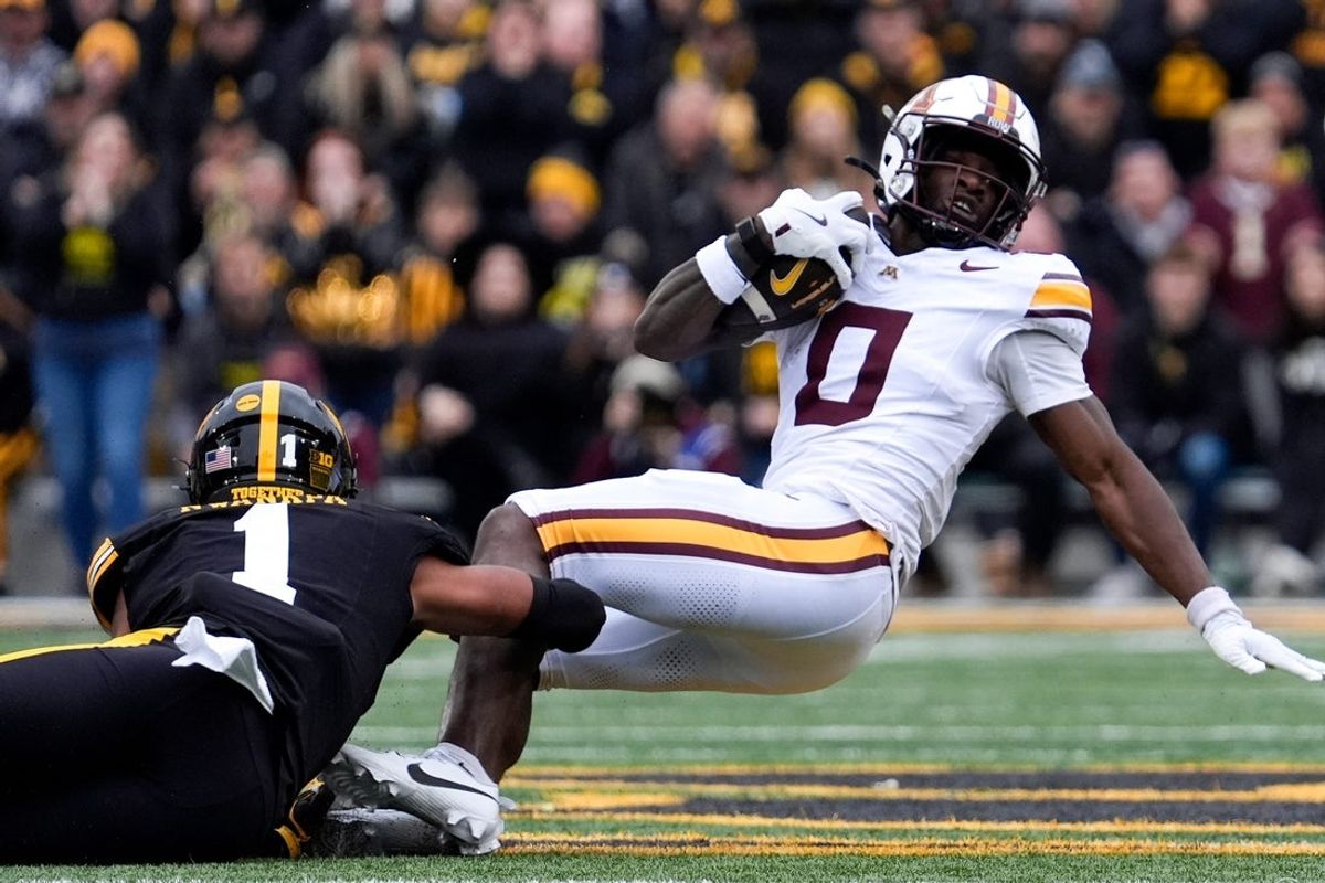 Iowa Hawkeyes wide receiver Kj Parker (1) tackles Minnesota Golden Gophers wide receiver Lemeke Brockington (0) Oct. 25, 2025 at Kinnick Stadium in Iowa City, Iowa.