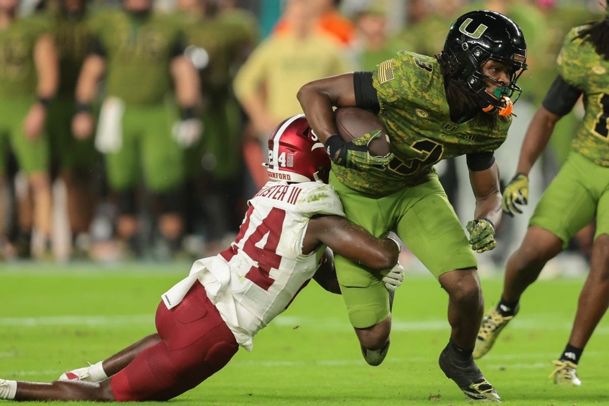 Oct 25, 2025; Miami Gardens, Florida, USA; Miami Hurricanes wide receiver Joshua Moore (3) carries the football against Stanford Cardinal cornerback Lonnie McAllister III (24) during the second quarter at Hard Rock Stadium. Mandatory Credit: Sam Navarro-Imagn Images