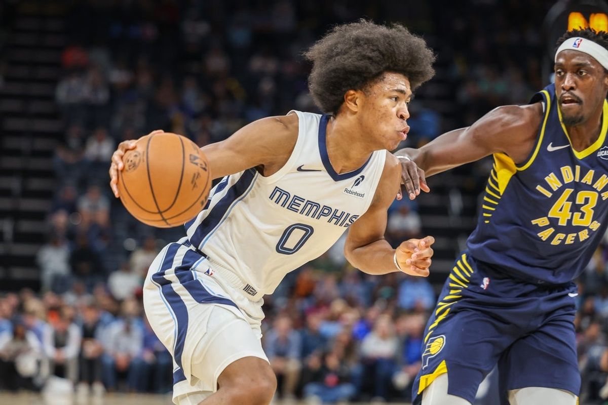 Oct 25, 2025; Memphis, Tennessee, USA; Memphis Grizzlies forward Jaylen Wells (0) drives against Indiana Pacers forward Pascal Siakam (43) during the first half at FedExForum. Mandatory Credit: Wesley Hale-Imagn Images