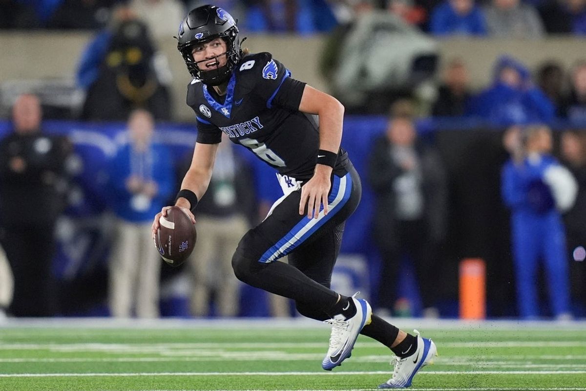 Kentucky quarterback Cutter Boley (8) scrambles with the ball during a NCAA football game against Kentucky at Kroger Field in Lexington, Kentucky on Oct. 25, 2025.