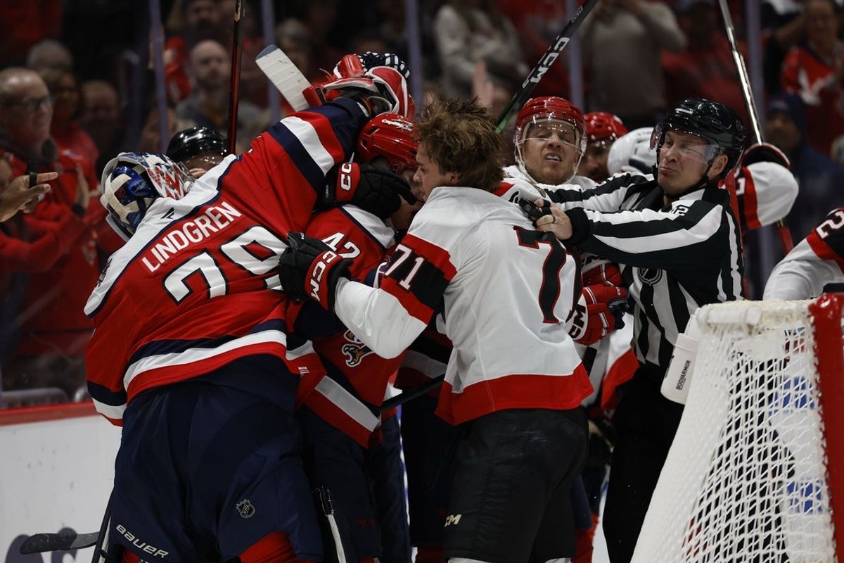 Oct 25, 2025; Washington, District of Columbia, USA; Washington Capitals goaltender Charlie Lindgren (79) gets involved in a scrum with Ottawa Senators center Ridly Greig (71) during the second period at Capital One Arena. Mandatory Credit: Geoff Burke-Imagn Images
