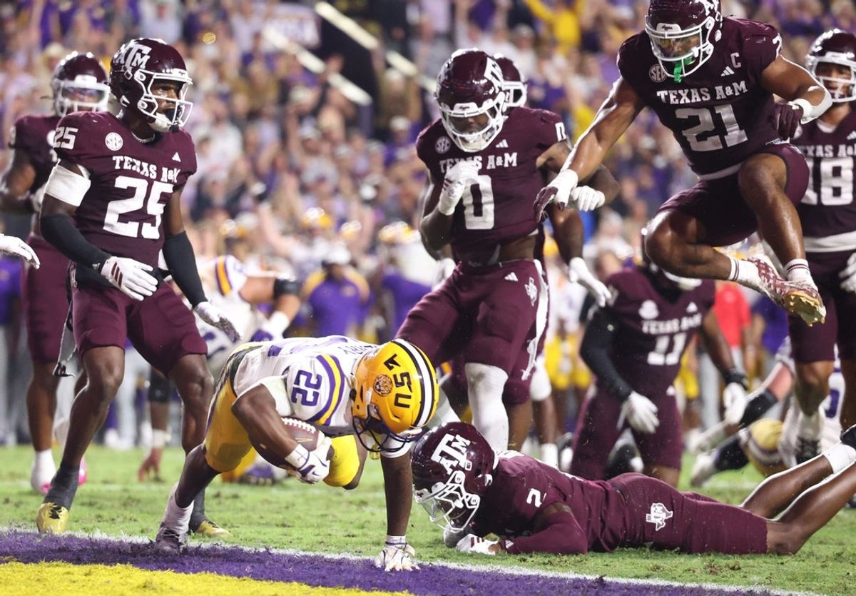 Oct 25, 2025; Baton Rouge, Louisiana, USA; Louisiana State Tigers running back Harlem Berry (22) scores a touchdown during the first half against the Texas A&M Aggies at Tiger Stadium. Mandatory Credit: Stephen Lew-Imagn Images
