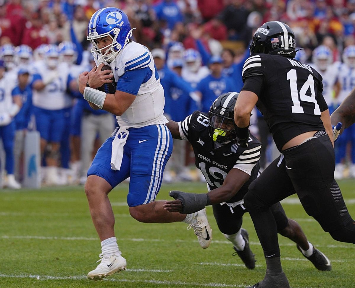 Iowa State Cyclones' defensive back Ta’Shawn James (19) and linebacker Carson Willich (14) miss tackle BYU Cougars quarterback Bear Bachmeier (47) as running for a touchdown during the third quarter at Jack Trice Stadium on Oct. 25, 2025, in Ames, Iowa.