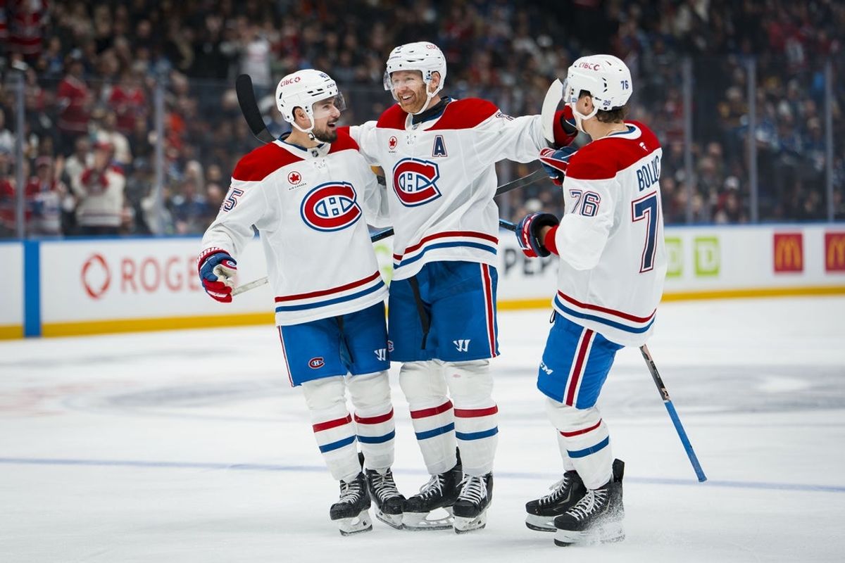 Oct 25, 2025; Vancouver, British Columbia, CAN; Montreal Canadiens defenseman Alexandre Carrier (45) and defenseman Mike Matheson (8) and forward Zachary Bolduc (76) celebrate Matheson’s goal against the Vancouver Canucks in the third period at Rogers Arena. Mandatory Credit: Bob Frid-Imagn Images