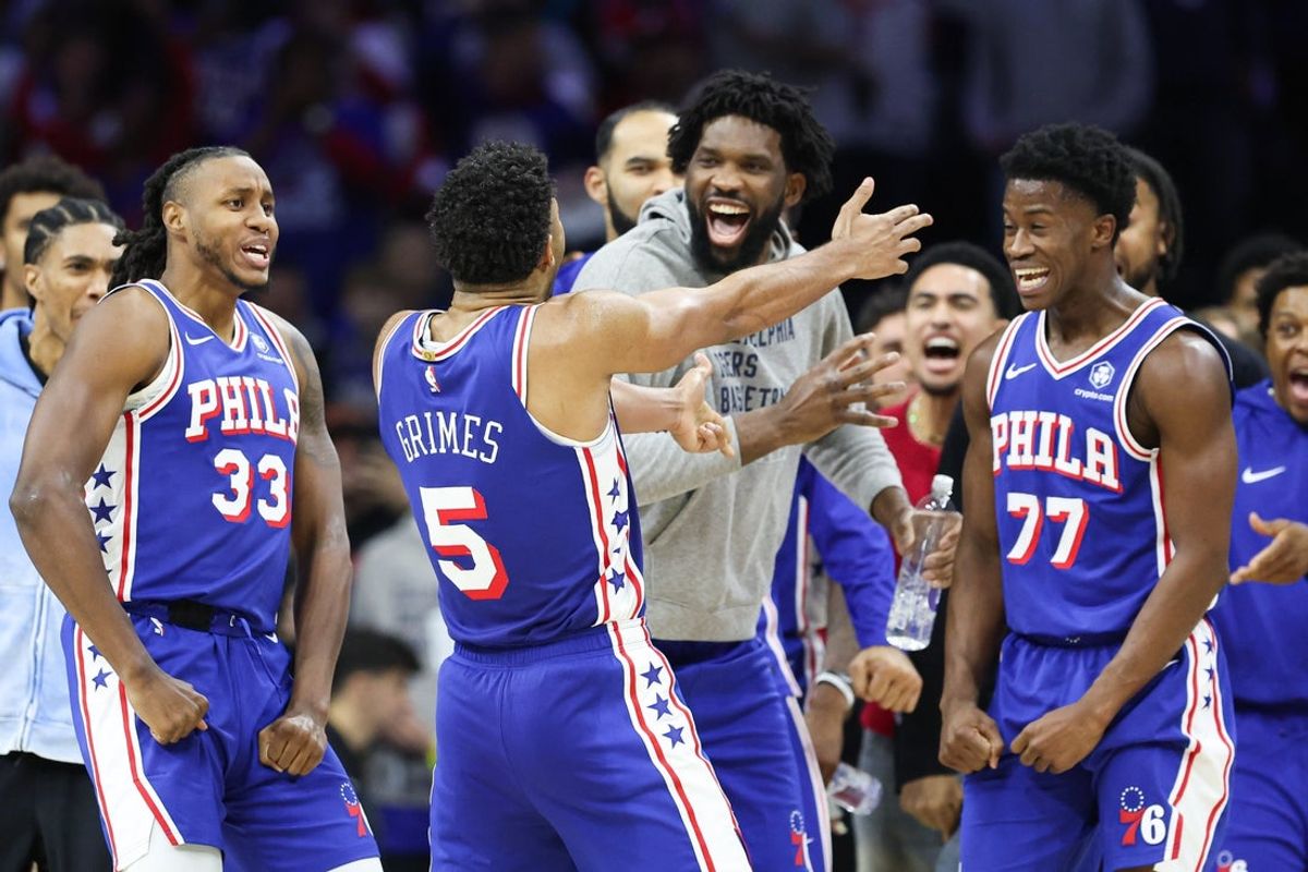 Oct 25, 2025; Philadelphia, Pennsylvania, USA; Philadelphia 76ers guard Quentin Grimes (5) celebrates with teammates after his score in the closing seconds of the fourth quarter against the Charlotte Hornets at Xfinity Mobile Arena. Mandatory Credit: Bill Streicher-Imagn Images