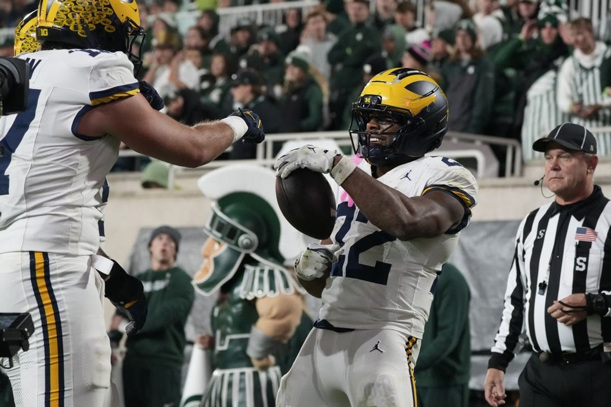 Oct 25, 2025; East Lansing, Michigan, USA; Michigan Wolverines running back Justice Haynes (22) reacts after running for a touchdown against the Michigan State Spartans during the second half at Spartan Stadium. Mandatory Credit: Brendan Mullin-Imagn Images