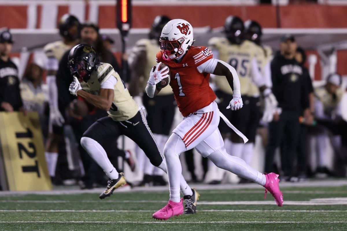 Oct 25, 2025; Salt Lake City, Utah, USA; Utah Utes running back Wayshawn Parker (1) runs the ball for a touchdown against the Colorado Buffaloes during the first quarter at Rice-Eccles Stadium. Mandatory Credit: Rob Gray-Imagn Images