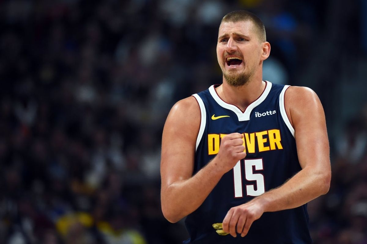 Oct 25, 2025; Denver, Colorado, USA; Denver Nuggets center Nikola Jokic (15) talks with the bench during the first half against the Phoenix Suns at Ball Arena. Mandatory Credit: Christopher Hanewinckel-Imagn Images