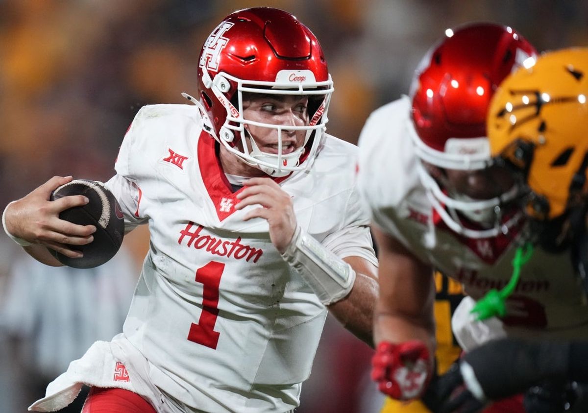 Houston Cougars quarterback Conner Weigman (1) scrambles with the ball as they play against the ASU Sun Devils at Mountain America Stadium in Tempe on Oct. 25, 2025.