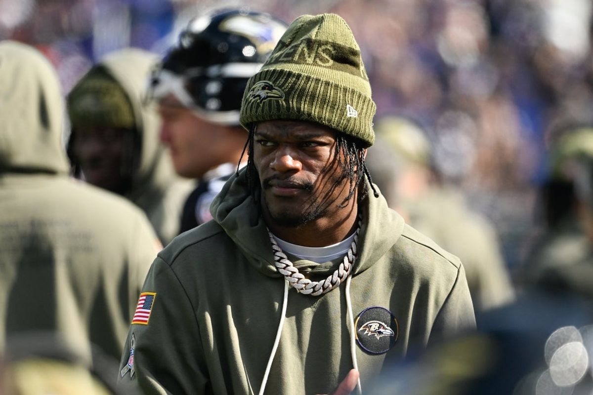 Oct 26, 2025; Baltimore, Maryland, USA; Baltimore Ravens quarterback Lamar Jackson (8) looks on from the sideline during the first quarter against the Chicago Bears at M&T Bank Stadium. Mandatory Credit: Tommy Gilligan-Imagn Images