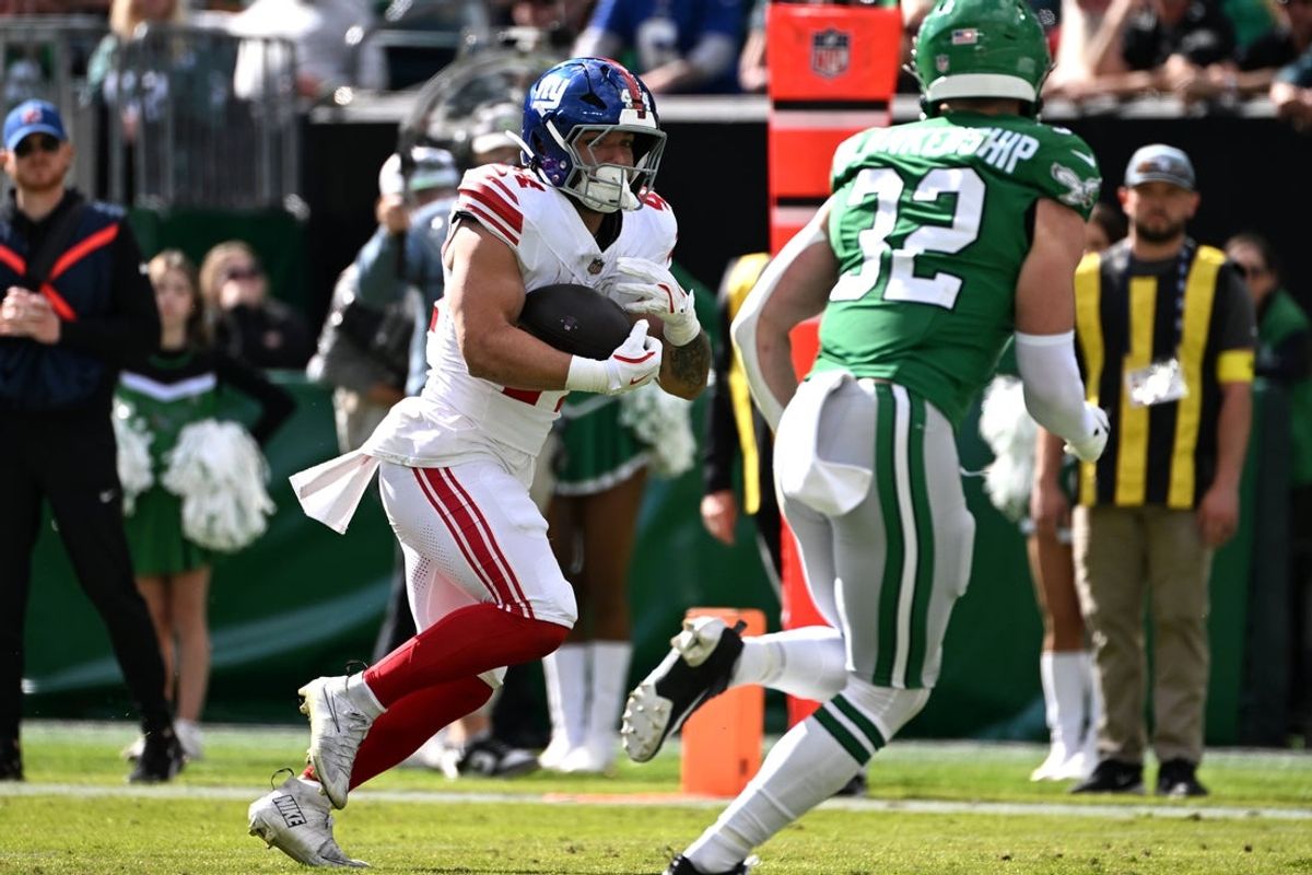 Oct 26, 2025; Philadelphia, Pennsylvania, USA; New York Giants running back Cam Skattebo (44) runs for a touchdown against the Philadelphia Eagles in the first quarter at Lincoln Financial Field. Mandatory Credit: Eric Hartline-Imagn Images