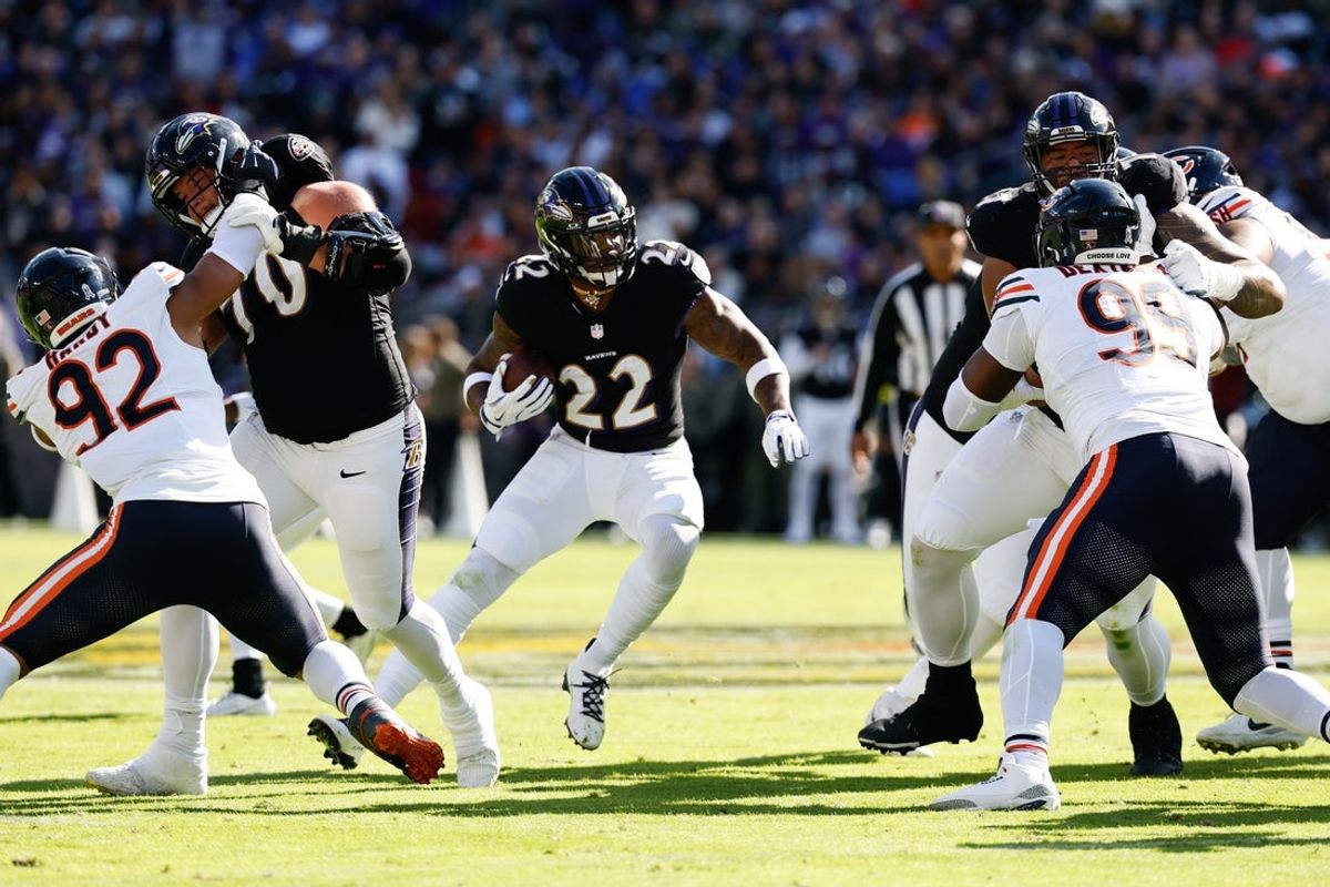 Oct 26, 2025; Baltimore, Maryland, USA; Baltimore Ravens running back Derrick Henry (22) rushes during the second quarter against the Chicago Bears at M&T Bank Stadium. Mandatory Credit: Geoff Burke-Imagn Images