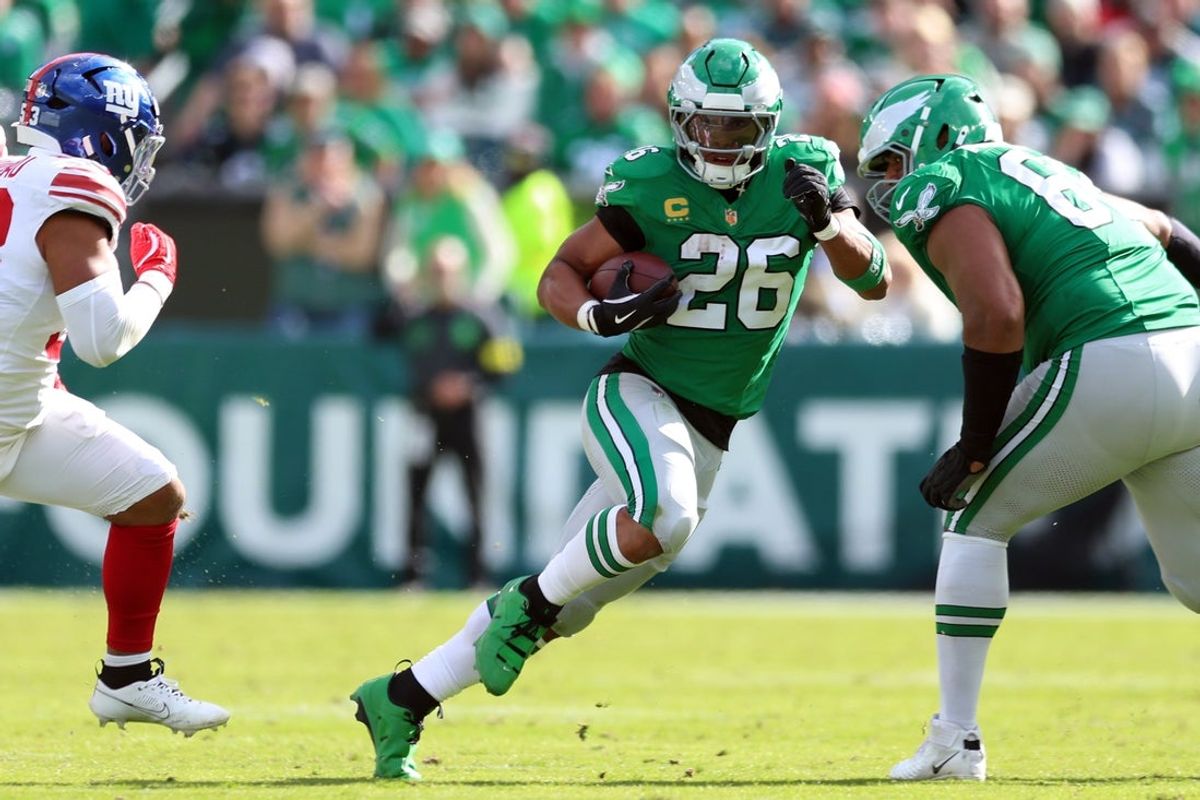 Oct 26, 2025; Philadelphia, Pennsylvania, USA;  Philadelphia Eagles running back Saquon Barkley (26) runs against the New York Giants in the second quarter at Lincoln Financial Field. Mandatory Credit: Bill Streicher-Imagn Images