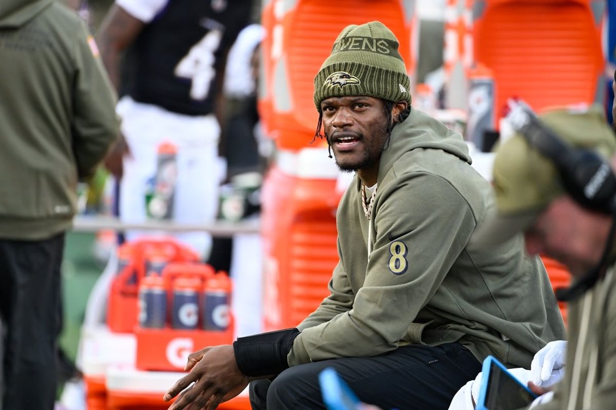 Oct 26, 2025; Baltimore, Maryland, USA; Baltimore Ravens quarterback Lamar Jackson (8) looks on from the sideline during the fourth quarter against the Chicago Bears at M&T Bank Stadium. Mandatory Credit: Tommy Gilligan-Imagn Images