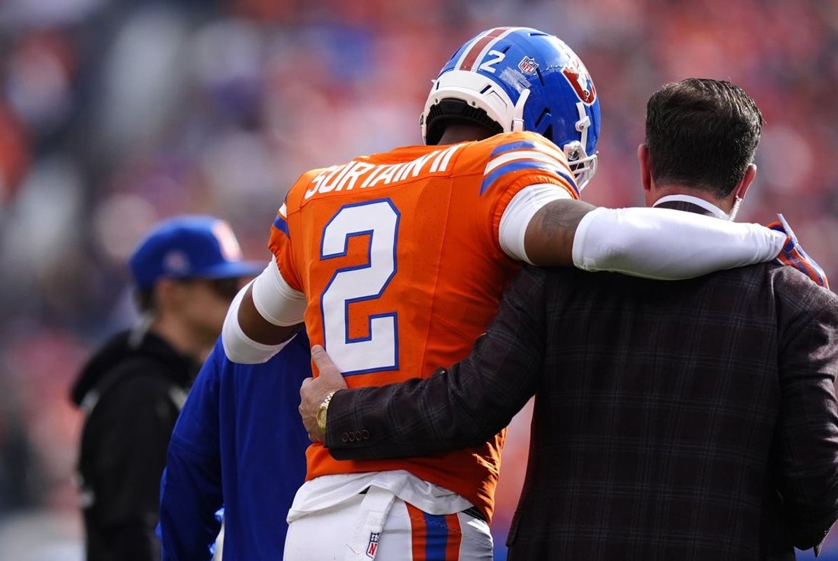 Oct 26, 2025; Denver, Colorado, USA; Denver Broncos cornerback Pat Surtain II (2) leaves the field after an injury in the first quarter against the Denver Broncos at Empower Field at Mile High. Mandatory Credit: Ron Chenoy-Imagn Images
