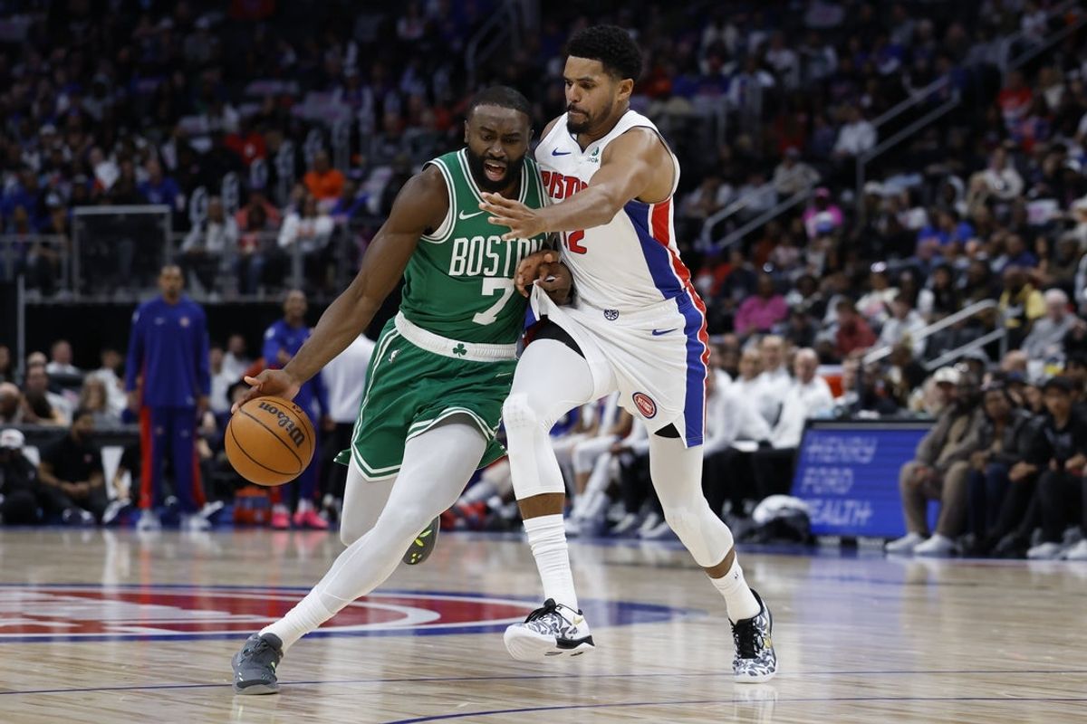 Oct 26, 2025; Detroit, Michigan, USA; Boston Celtics guard Jaylen Brown (7) dribbles defended by Detroit Pistons forward Tobias Harris (12) in the first half at Little Caesars Arena. Mandatory Credit: Rick Osentoski-Imagn Images