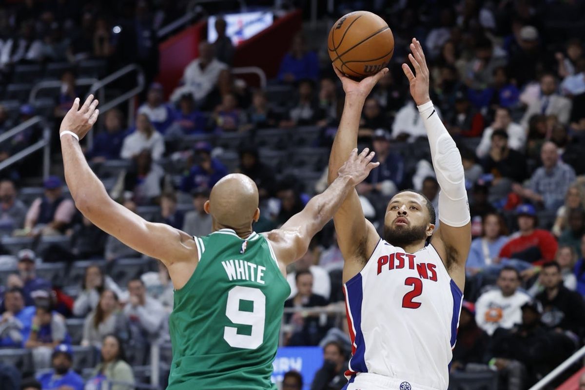 Oct 26, 2025; Detroit, Michigan, USA;  Detroit Pistons guard Cade Cunningham (2) shoots on Boston Celtics guard Derrick White (9) in the second half at Little Caesars Arena. Mandatory Credit: Rick Osentoski-Imagn Images