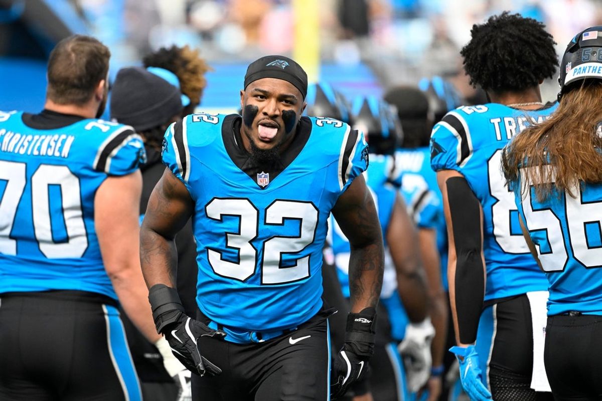 Oct 26, 2025; Charlotte, North Carolina, USA; Carolina Panthers linebacker Trevin Wallace (32) runs on to the field before the game at Bank of America Stadium. Mandatory Credit: Bob Donnan-Imagn Images