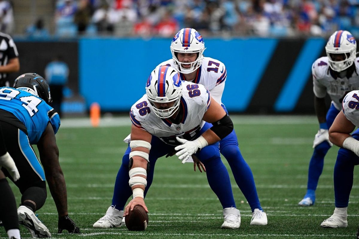 Oct 26, 2025; Charlotte, North Carolina, USA; Buffalo Bills center Connor McGovern (66) prepares to hike the ball to quarterback Josh Allen (17) in the third quarter at Bank of America Stadium. Mandatory Credit: Bob Donnan-Imagn Images