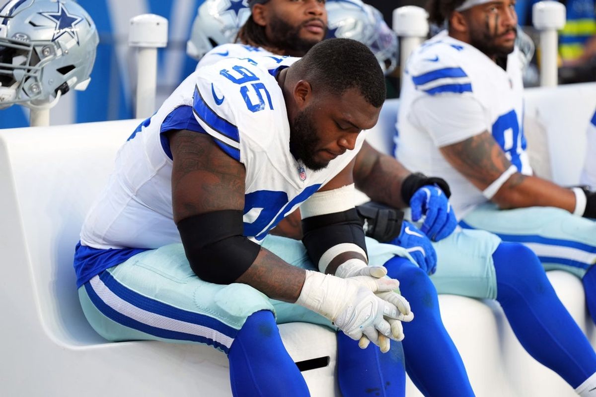 Oct 26, 2025; Denver, Colorado, USA; Dallas Cowboys defensive tackle Kenny Clark (95) reacts on the bench in the second half against the Denver Broncos at Empower Field at Mile High. Mandatory Credit: Ron Chenoy-Imagn Images