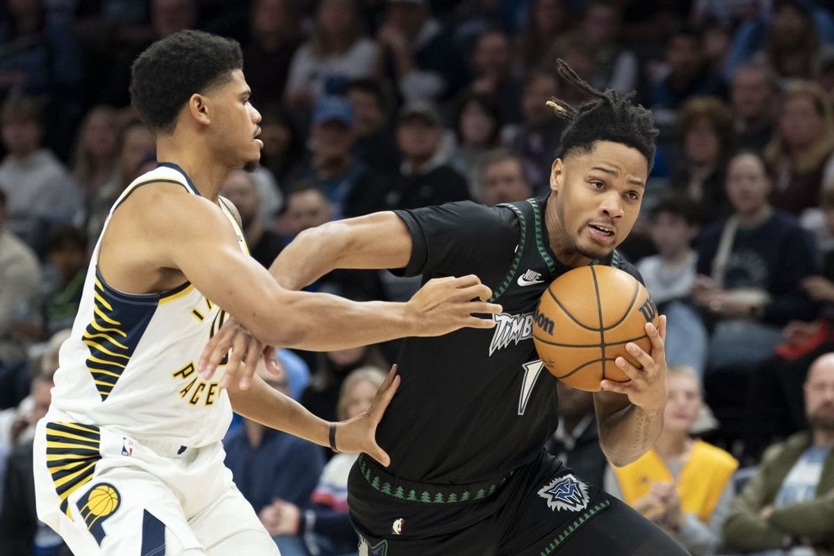 Oct 26, 2025; Minneapolis, Minnesota, USA; Minnesota Timberwolves guard Terrence Shannon Jr. (1) drives to the basket past Indiana Pacers guard RayJ Dennis (10) in the first half at Target Center. Mandatory Credit: Jesse Johnson-Imagn Images